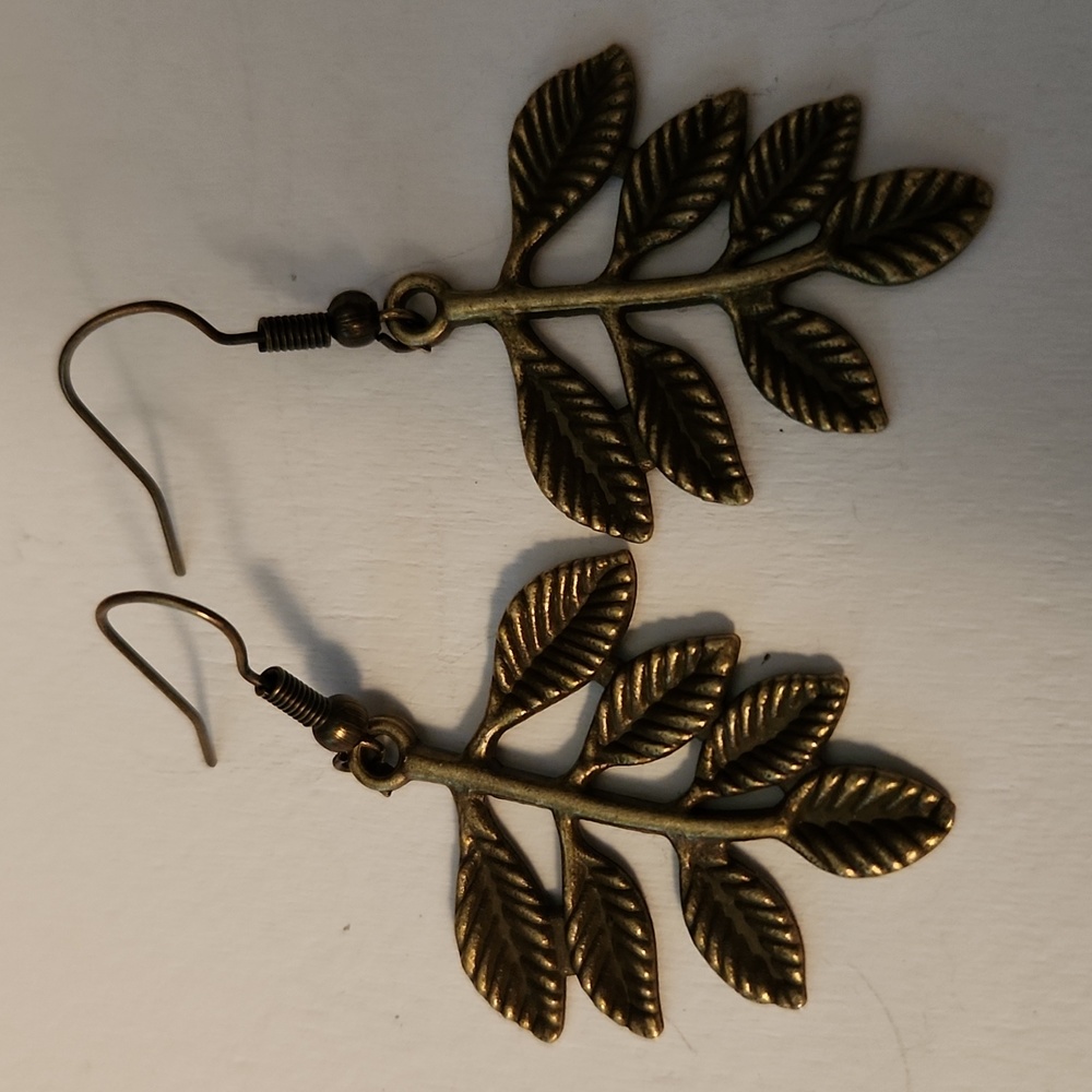 Handcrafted leaf earrings in a rich, bronze color